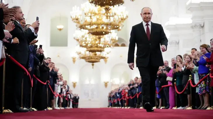 Vladimir Putin delivering his inauguration speech at the Grand Kremlin Palace, reaffirming his commitment to serve Russia and uphold its constitution.